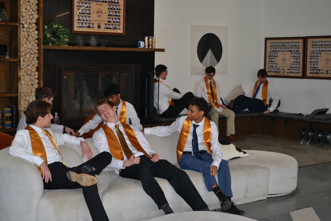 Seniors relaxing in their stoles in the chapter house lounge