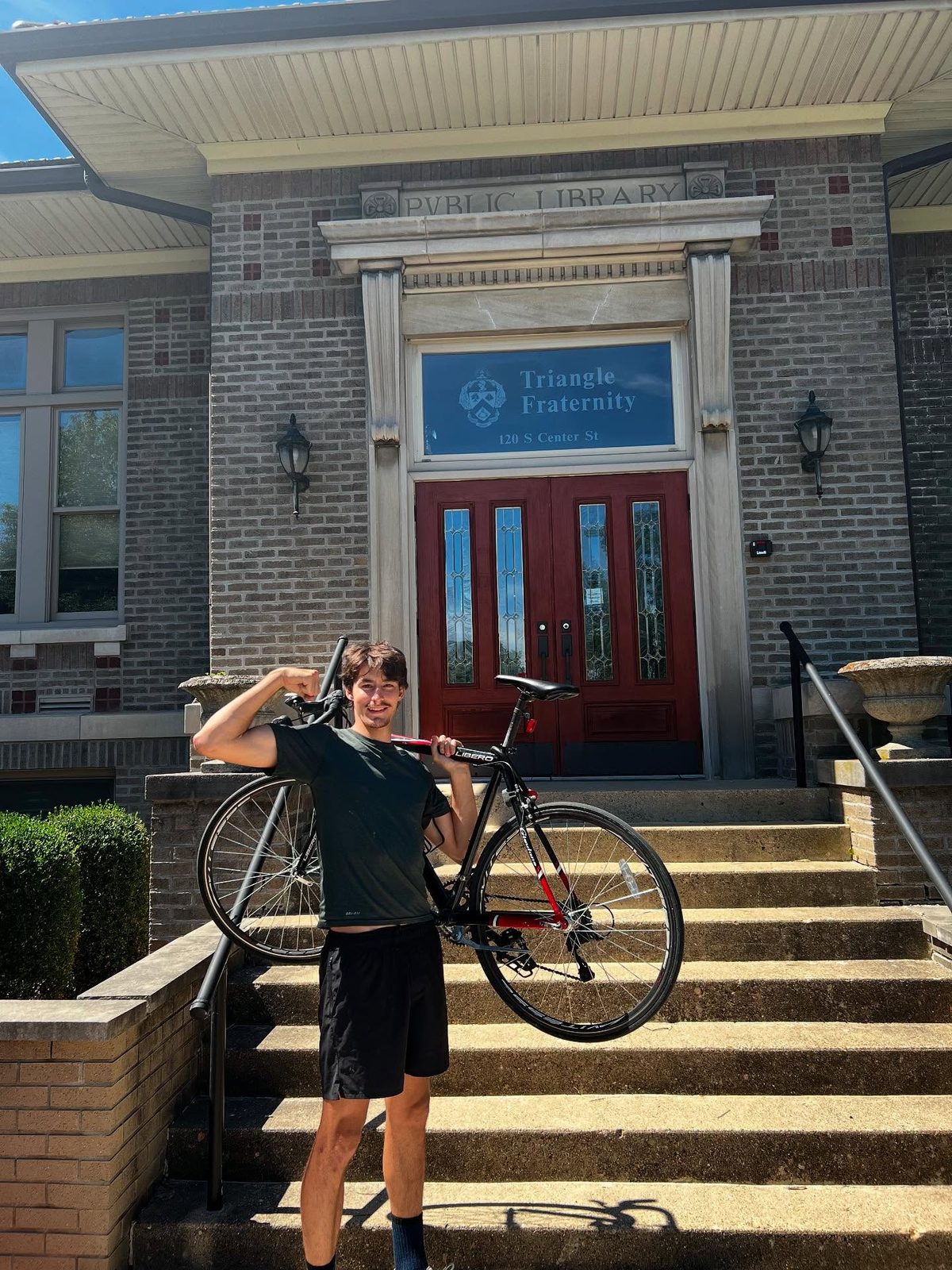 A brother with his bike at Triangle's National Headquarters